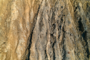 Aerial shot, drone point of view from above old abandoned mines of Mazarron in Murcia on blue sky background during sunny summer day. Mineral extraction industry, history concept. Spain