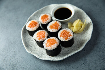 Homemade salmon maki rolls with soy sauce