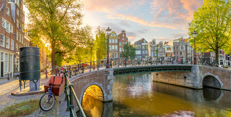 Soul of Amsterdam. Early morning in Amsterdam. Old houses, bridges, bicycles and the famous...