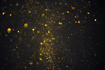 Gold glitter particles burst abstract bokeh lights dark background