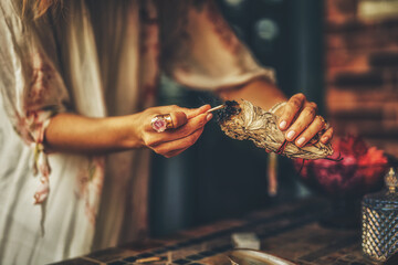 incense in a woman hand, ceremony space.