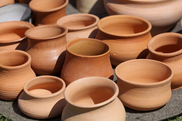 Clay jars at the market for food.