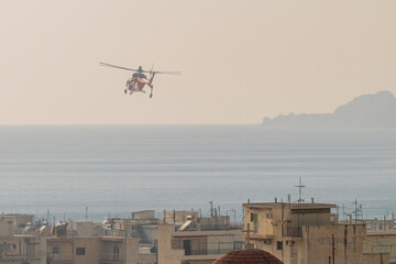  Fire helicopter against the sky at Loutraki in Greece.