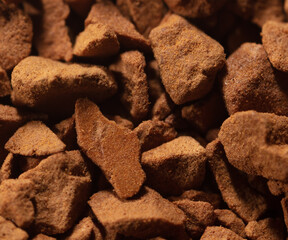Instant coffee granules as background.
