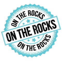 ON THE ROCKS text on blue-black round stamp sign
