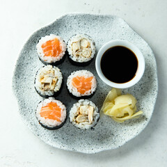 Healthy sushi rolls with salmon and eel