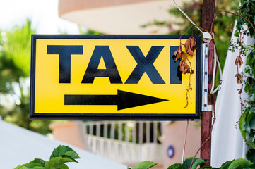 Taxi rank sign in cityscape
