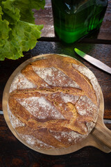 Freshly baked loaf of wheat bread. Homemade round and freshly baked bread. Delicious round and large bread.