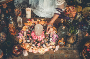 beautiful altar with crystals and rose flowers.