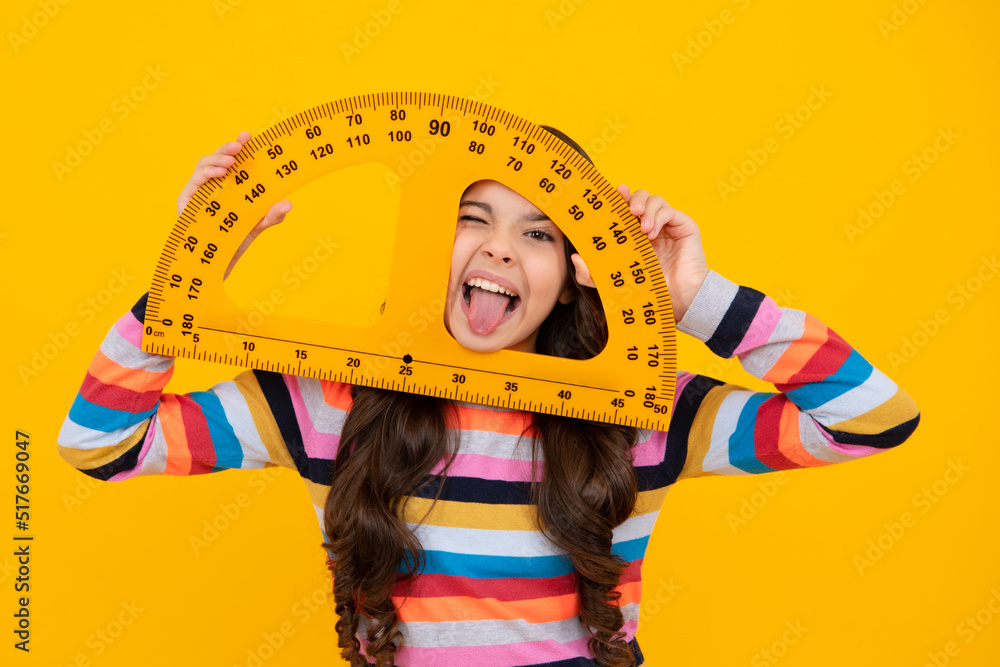 Wall mural funny face. measuring school equipment. schoolgirl holding measure for geometry lesson, isolated on 