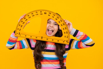 Funny face. Measuring school equipment. Schoolgirl holding measure for geometry lesson, isolated on...