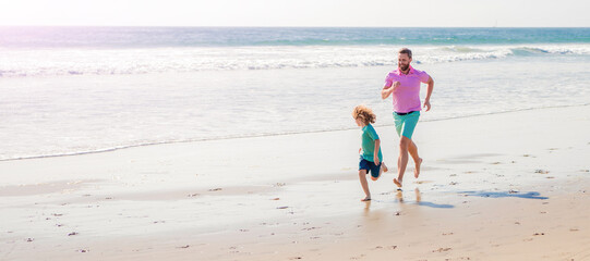 Father and son run on summer beach outdoor, banner poster with copy space, father and son family...