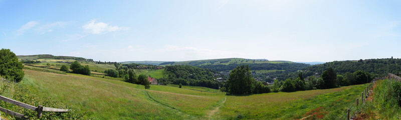 long panoramic view of the calder valley in west yorkshire with hebden bridge and heptonstall...