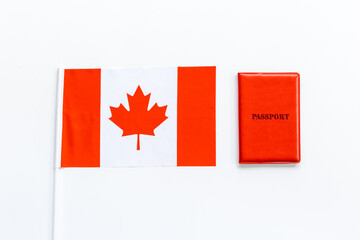 Fototapeta na wymiar Flag of Canada with passport. Travel visa and citizenship concept