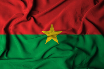 selective focus burkina faso flag, with waving fabric texture. 3D illustration