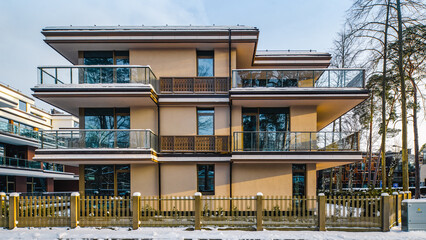 Modern facade of new luxury residential building at winter.