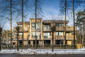 Fototapeta na wymiar Modern facade of new luxury residential building at winter.
