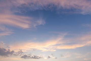 Amazing wispy sunset sky with pink clouds in spring in Norfolk England. Cloudscape scene with no people