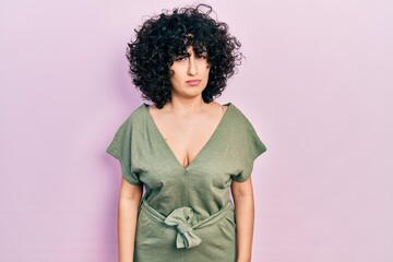 Young middle east woman wearing casual clothes skeptic and nervous, frowning upset because of...
