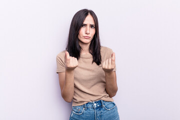 Young caucasian woman isolated on pink background showing that she has no money.