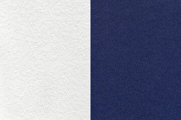 Fototapeta premium Texture of craft white and navy blue paper background, half two colors, macro. Structure of vintage dense denim cardboard.