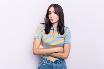 Young caucasian woman isolated on pink background unhappy looking in camera with sarcastic expression.