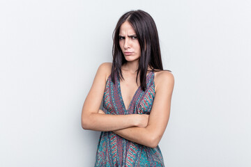 Young caucasian woman isolated on white background frowning face in displeasure, keeps arms folded.