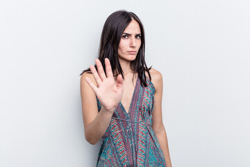 Young caucasian woman isolated on white background rejecting someone showing a gesture of disgust.