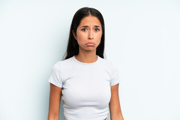 hispanic pretty woman feeling sad and whiney with an unhappy look, crying with a negative and...