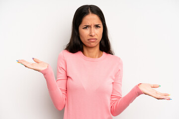 hispanic pretty woman looking puzzled, confused and stressed, wondering between different options,...