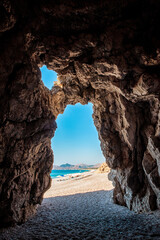 Rock cave on the Traganou beach in Rhodes island, Greece