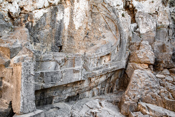 Historic warship relief on the rock in Lindos acropolis at Rhodes island in Greece