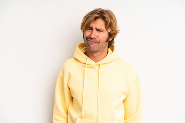 blond adult man feeling confused and doubtful, wondering or trying to choose or make a decision