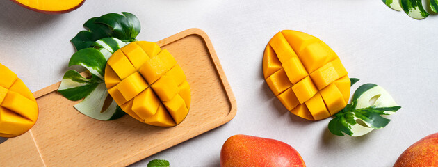 Mango background design concept. Top view Diced fresh mango fruit on gray table.