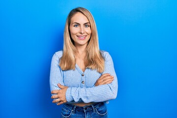 Young caucasian woman wearing casual clothes happy face smiling with crossed arms looking at the camera. positive person.