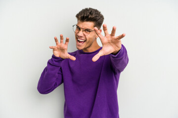 Young caucasian man isolated on white background upset screaming with tense hands.