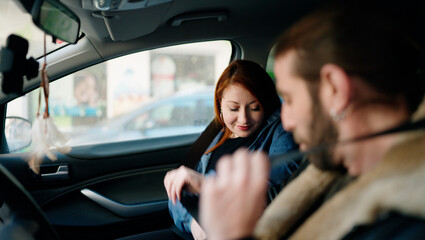 Fototapeta na wymiar Man and woman couple smiling confident driving car at street