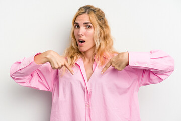 Young caucasian woman isolated on white background points down with fingers, positive feeling.