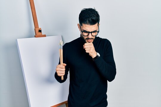 Handsome Man With Beard Holding Brushes Close To Easel Stand Feeling Unwell And Coughing As Symptom For Cold Or Bronchitis. Health Care Concept.