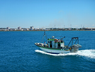 Fishing boat sailing on the river