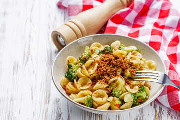 orequette pasta with broccoli on a white background