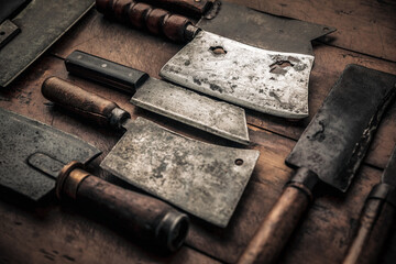 rusty old collection of meat butchers with sharp blade and wooden handle