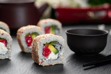 Sushi roll Philadelphia . Traditional delicious fresh sushi roll set with reflection . Sushi menu. Japanese kitchen, restaurant.