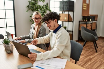 Two business executives working at the office.
