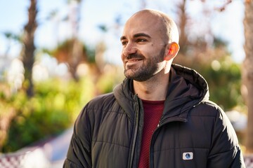 Young man smiling confident standing at park