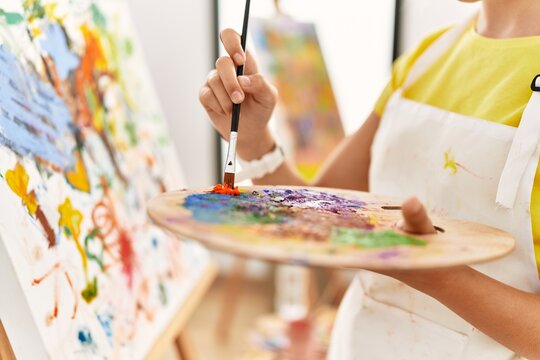 Adorable girl drawing at art studio