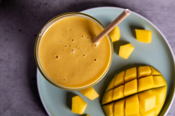 Indian cocktail, drink Mango Lassi with honey, close up