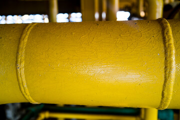 Deterioration of paint on oil and gas pipes.