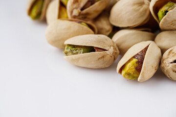 fresh salted pistachios on a white background