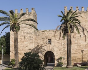 Porta del Moll. A stone gate with two battlemented towers, originally built into the walls from the 14th century. Alcúdia, Mallorca, Spain.